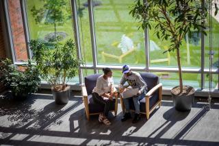 students inside talking on campus